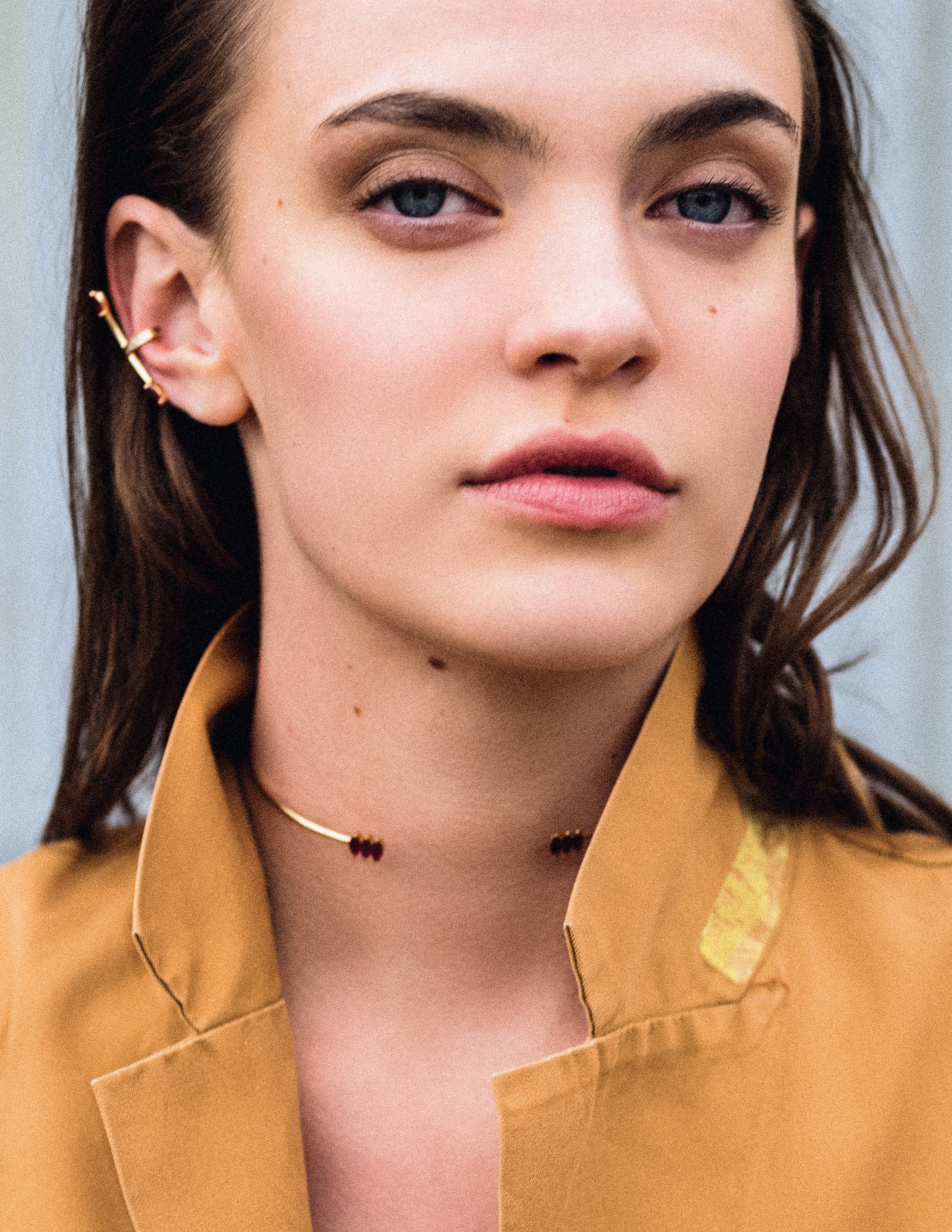 Close portrait in a ochre jacket