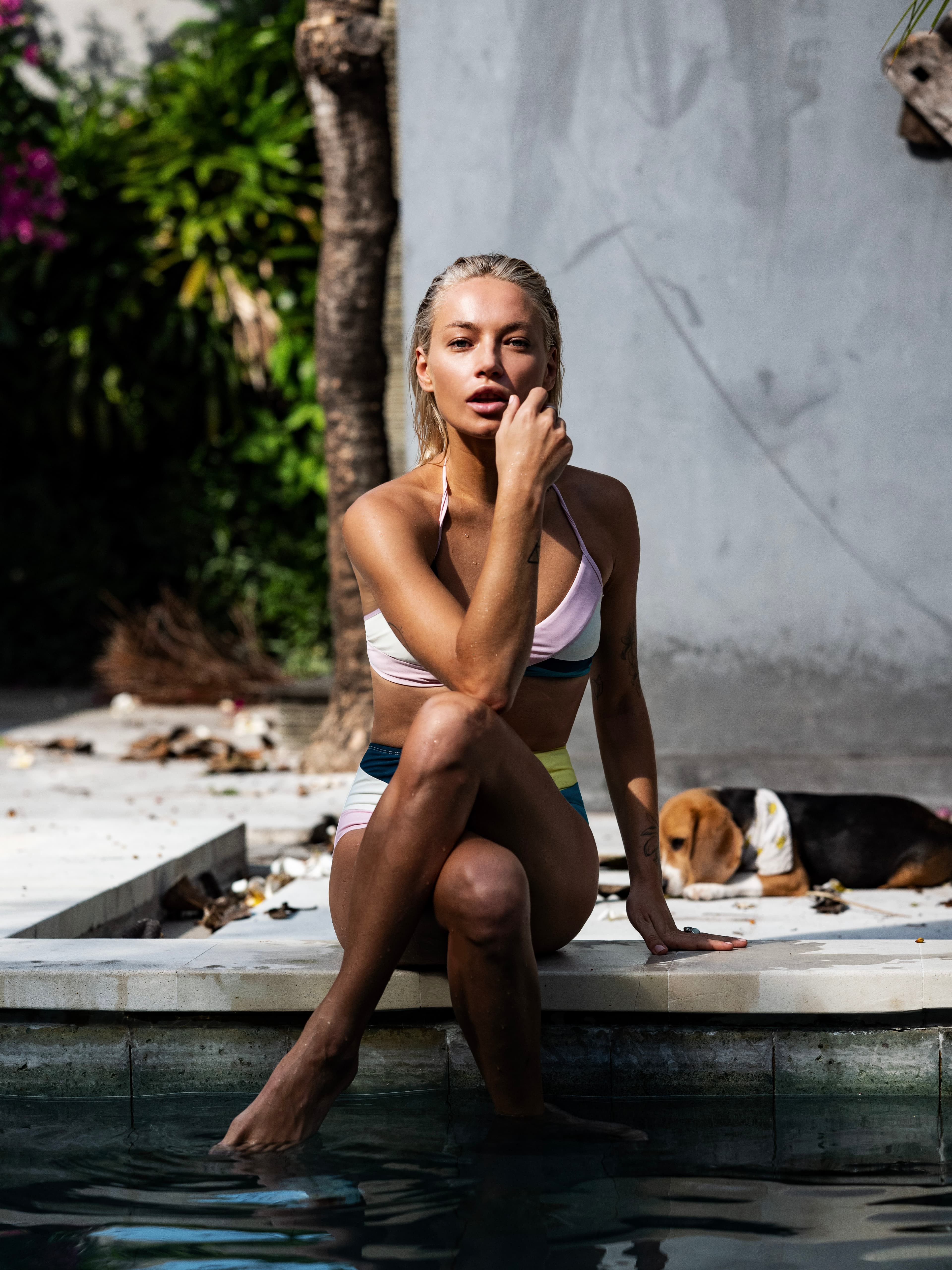Sunlit portrait beside a swimming pool