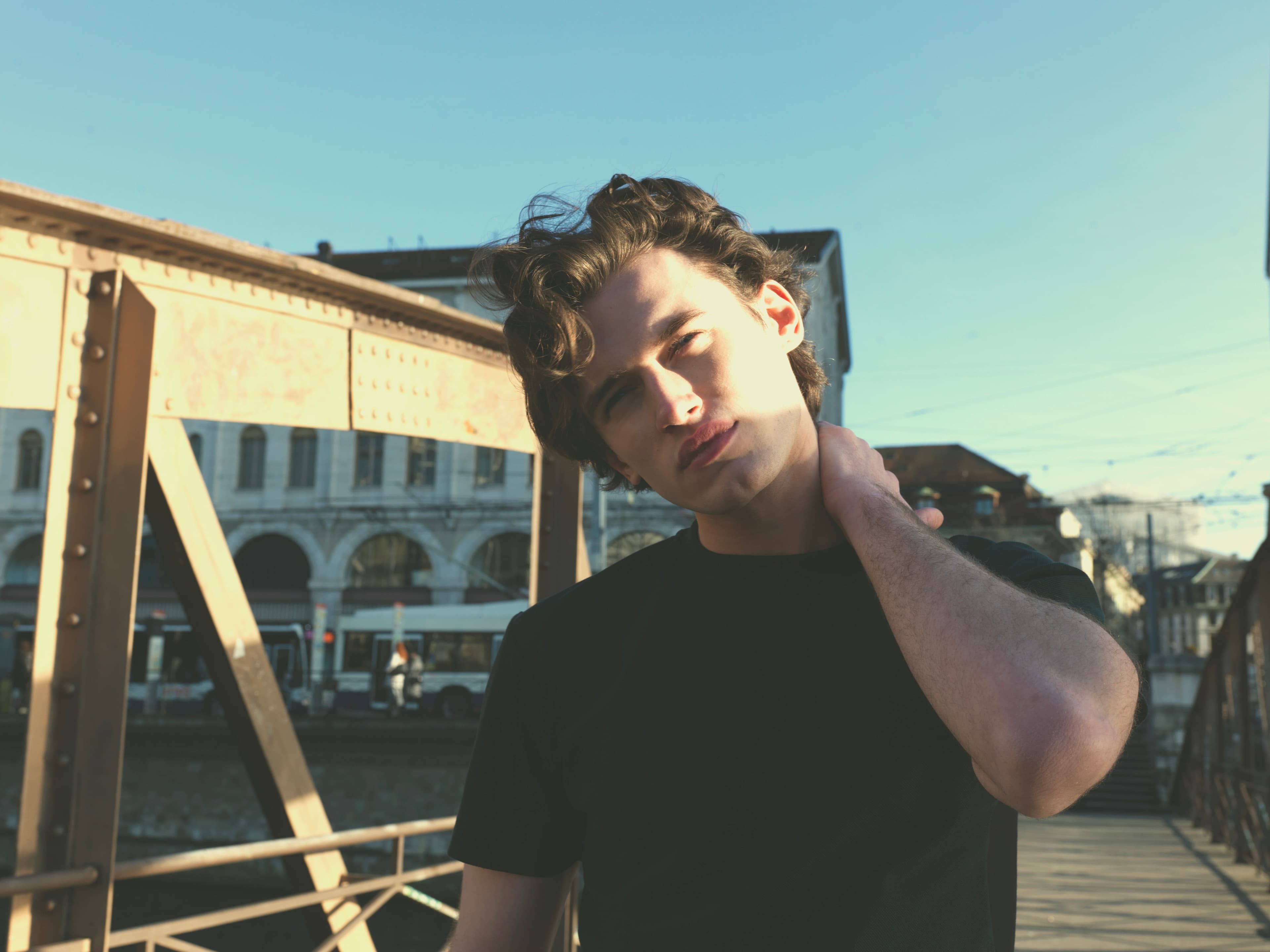 Portrait on a city footbridge in warm evening light