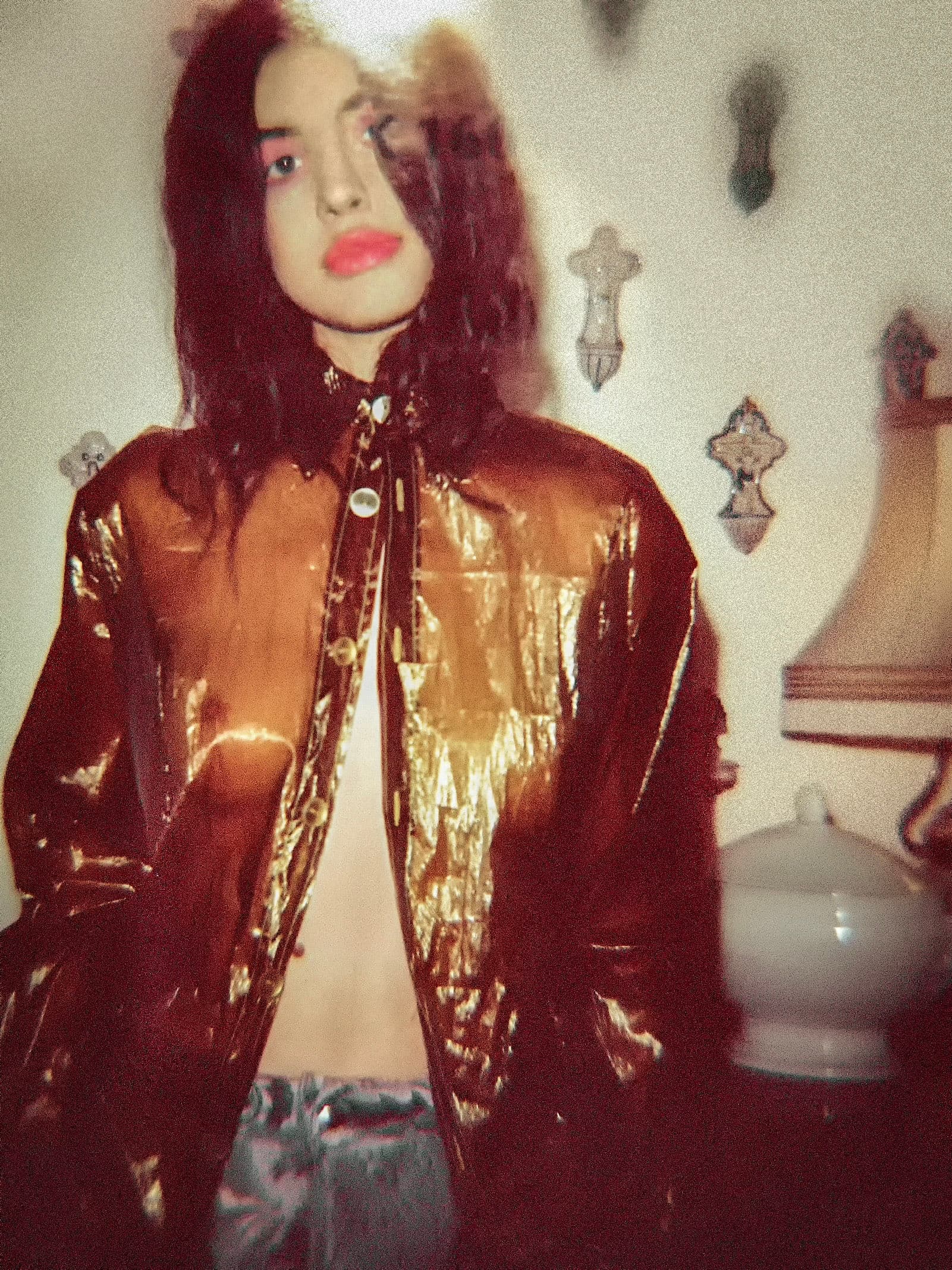 Portrait in a reflective copper jacket